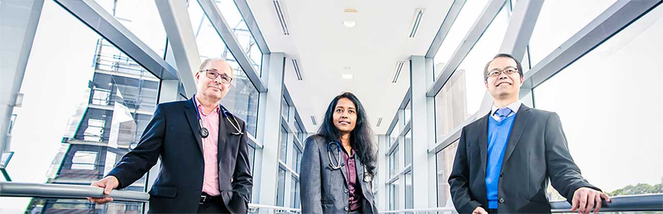 Three doctors standing in the corridor 