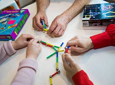 Three pair of-hands playing a game