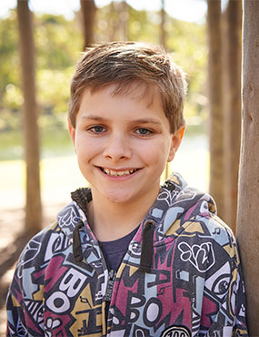 Jack, a smiling eleven year old boy.