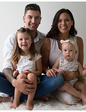 Luke Smith, a carrier of familial MND, with his wife Cobie and their two children.