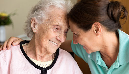 An older woman with her carer