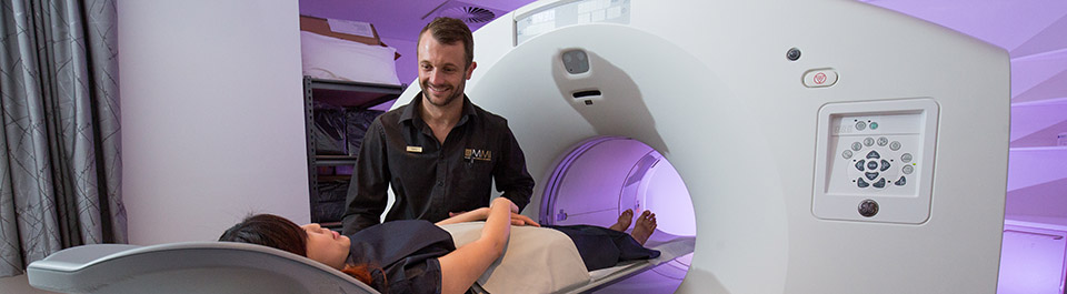 A clinician putting a patient in an MRI