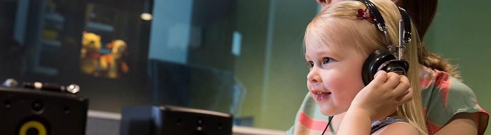 A child with headphones on