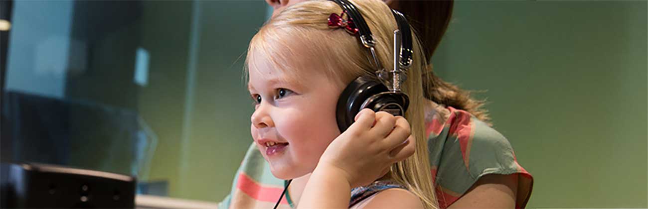 A child with headphones on