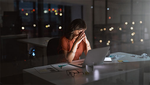 A woman in an office late at night