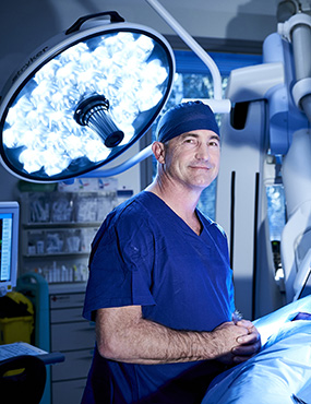Professor Michael Wilson with surgical robot.